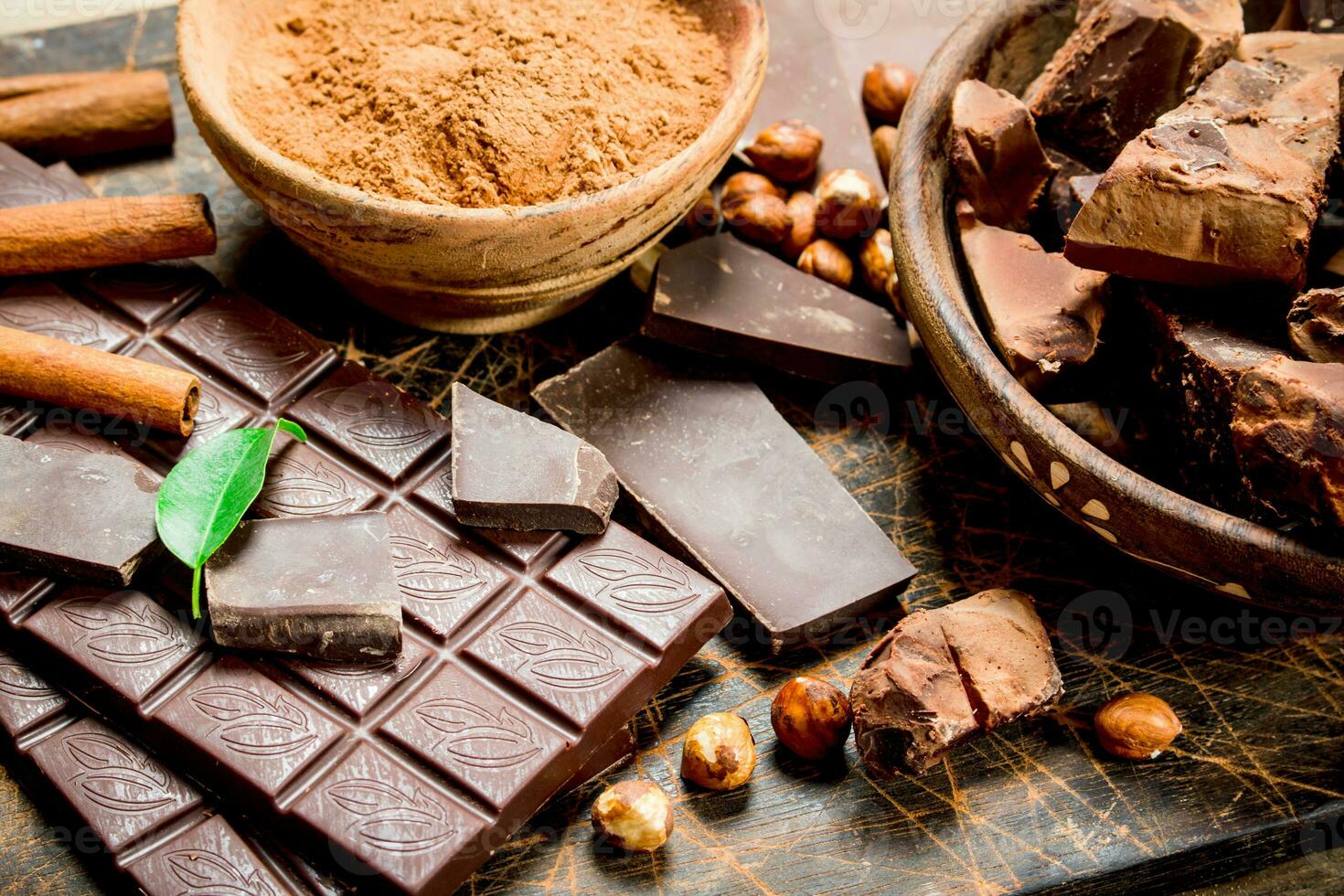 Chocolate background. Chocolate with cocoa powder and cinnamon. photo