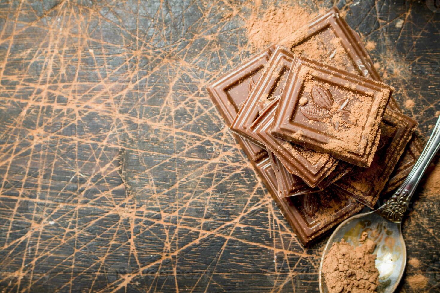 Chocolate slices with cocoa powder. photo