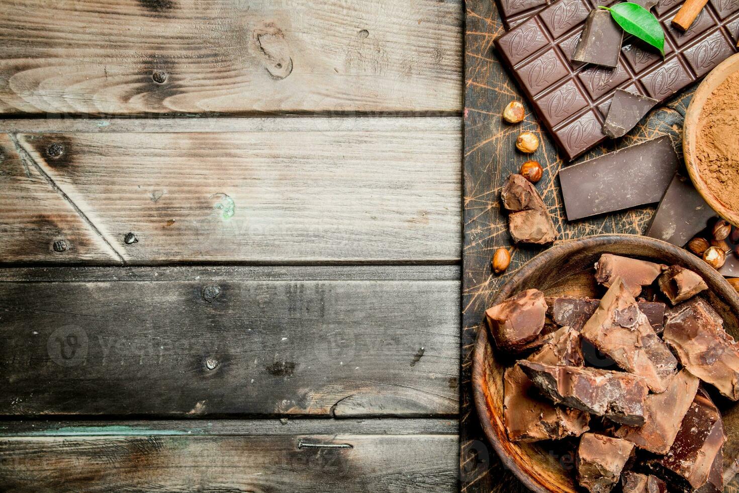 Chocolate background. Chocolate with cocoa powder and cinnamon. photo
