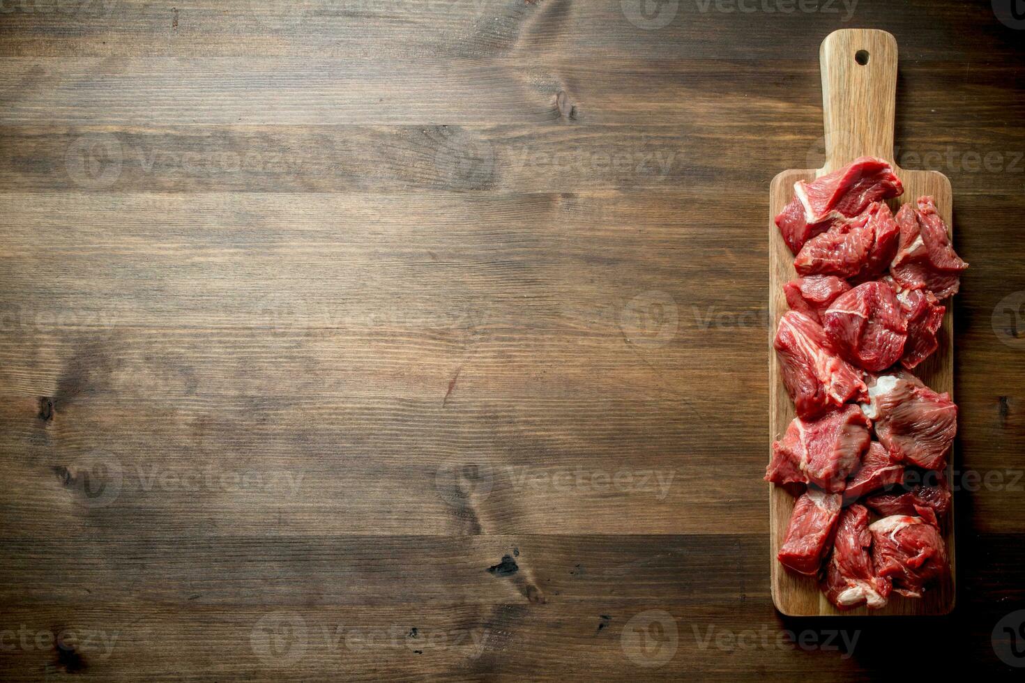Sliced raw beef on a cutting Board. photo