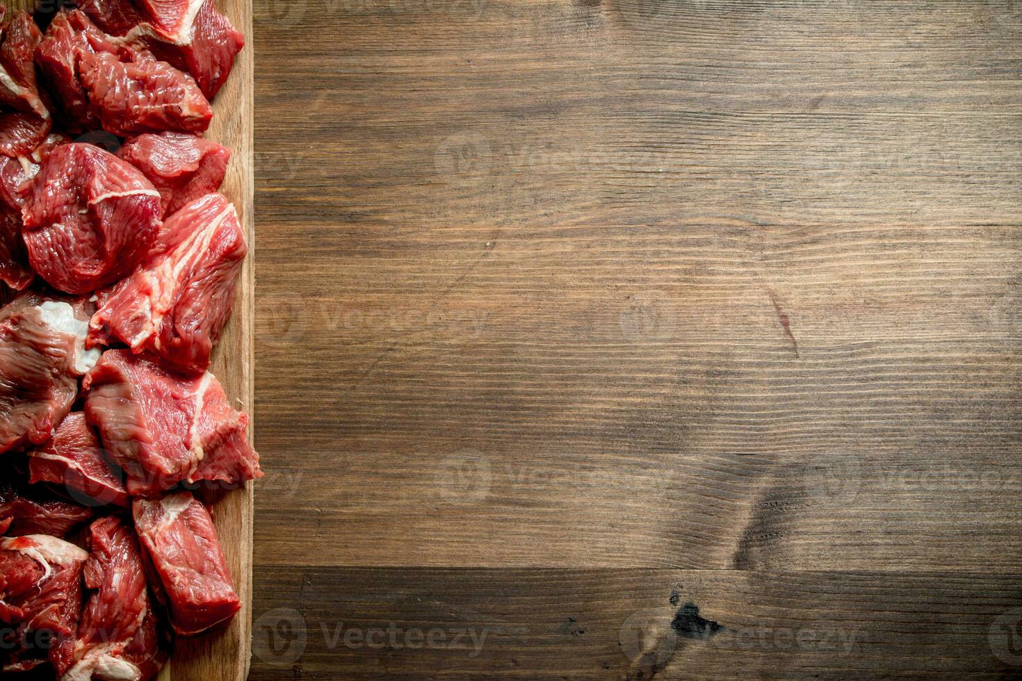 Sliced raw beef on a cutting Board. photo