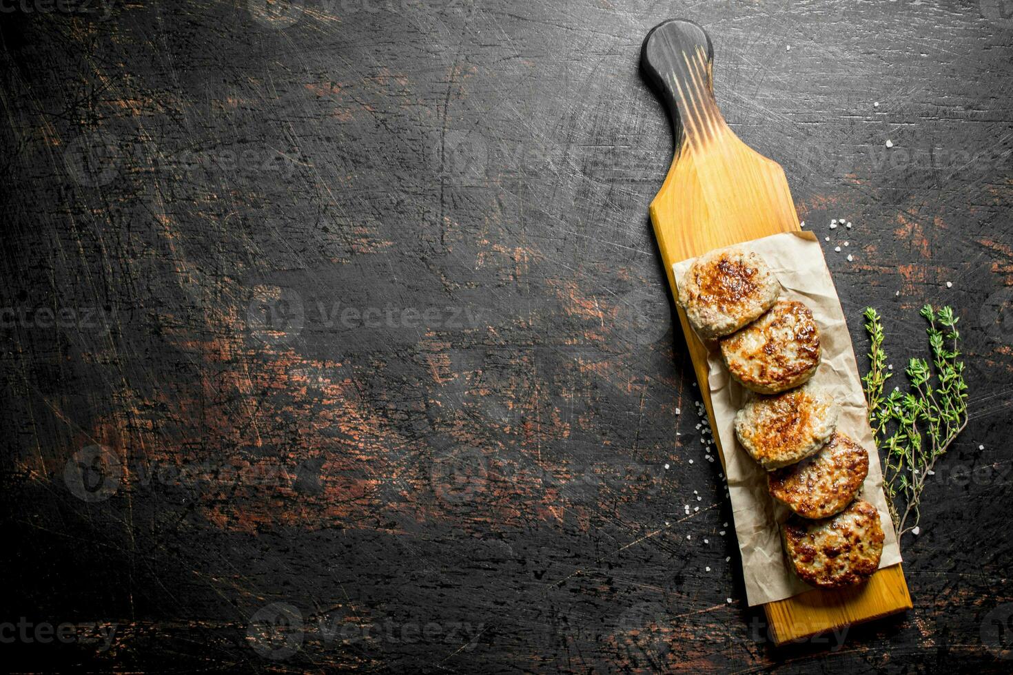 Cutlets on paper with thyme. photo