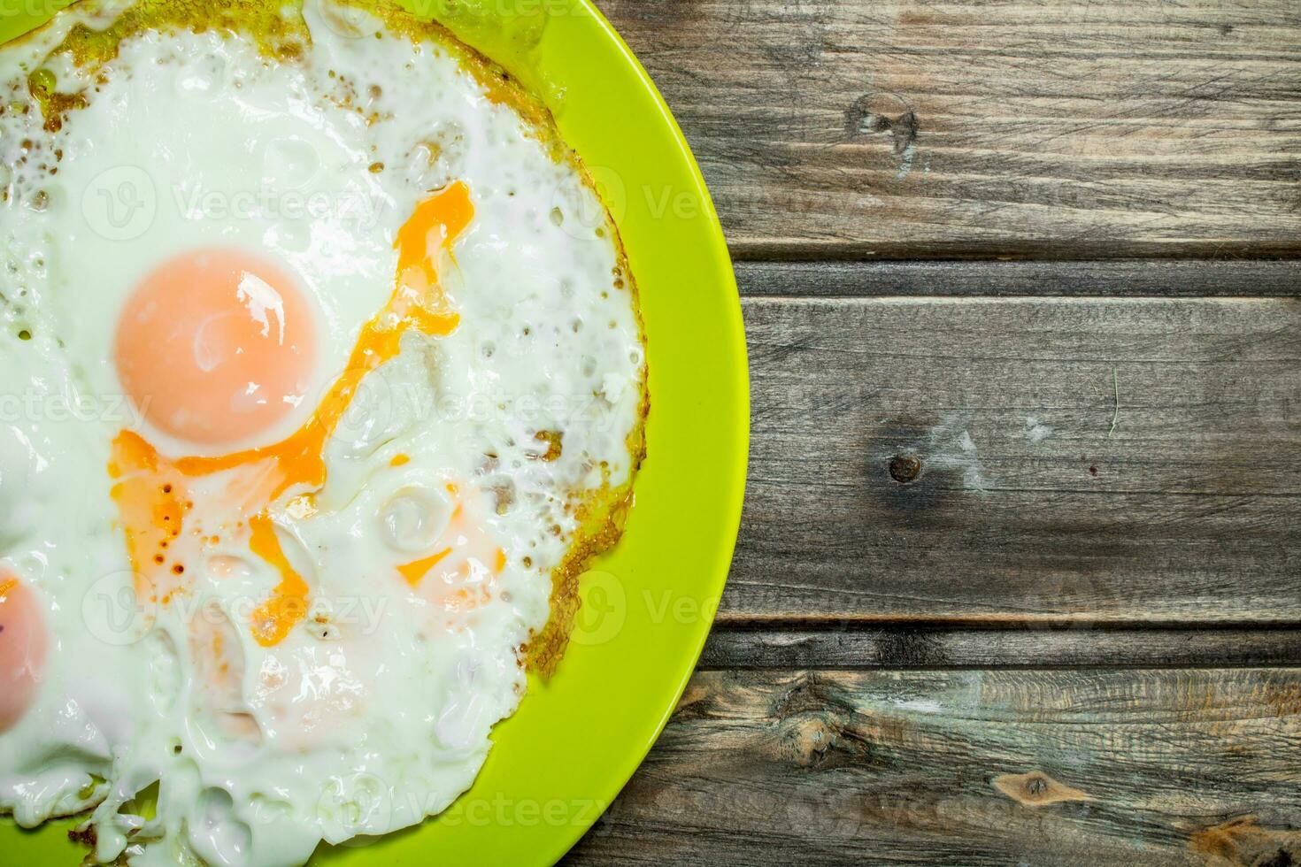 Fried eggs on a plate. photo