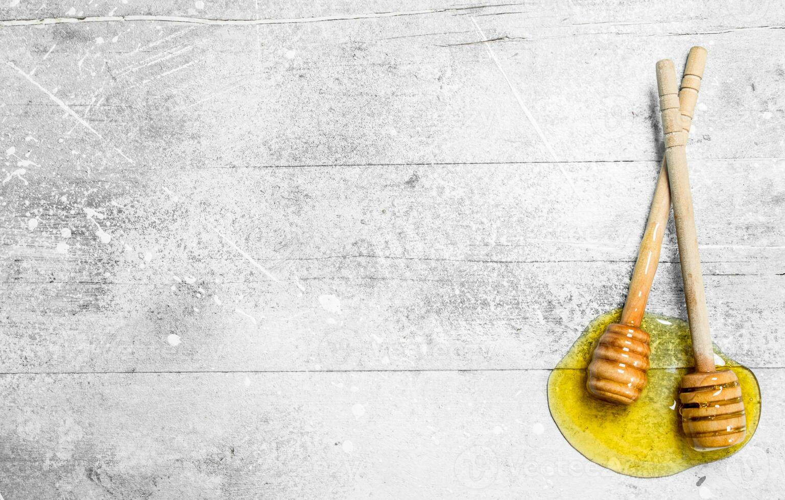 Natural honey with a wooden spoon. photo