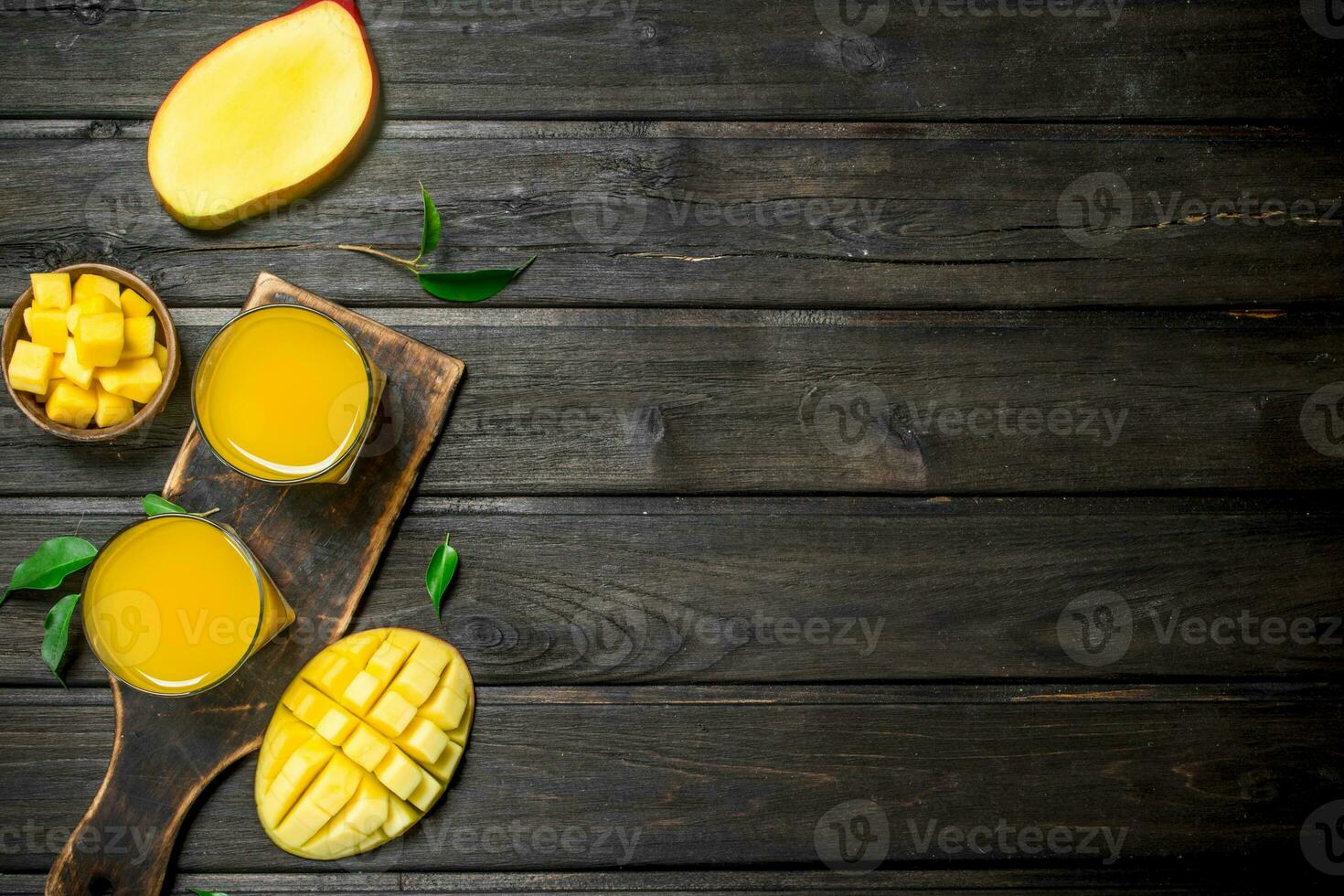 Mango juice in a glass on a cutting Board. photo