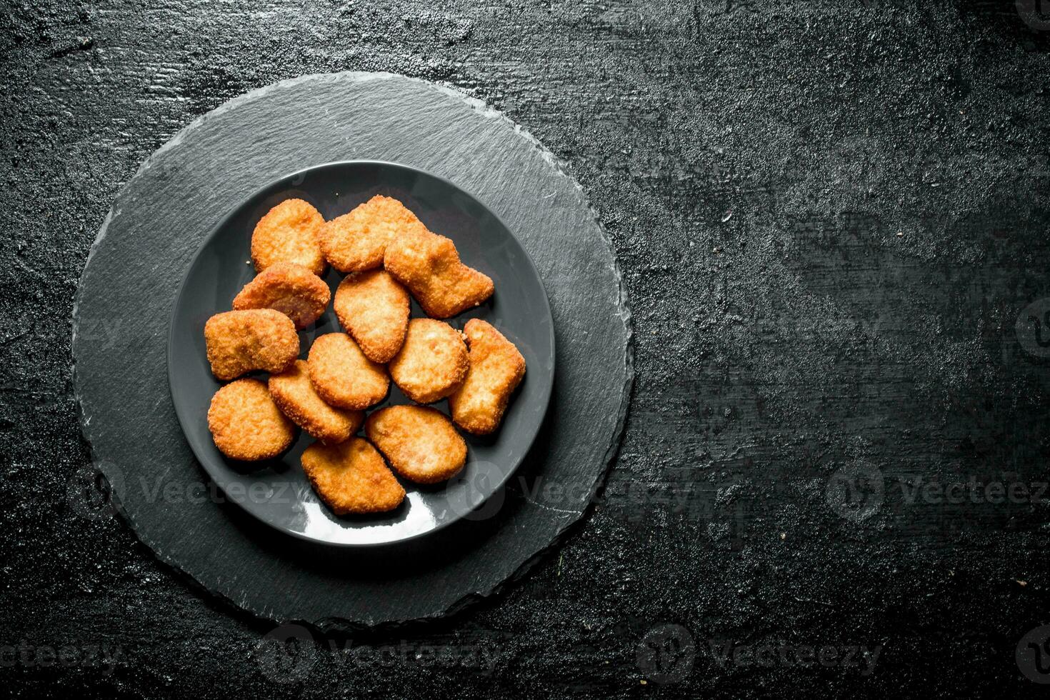 Chicken nuggets on the plate. photo