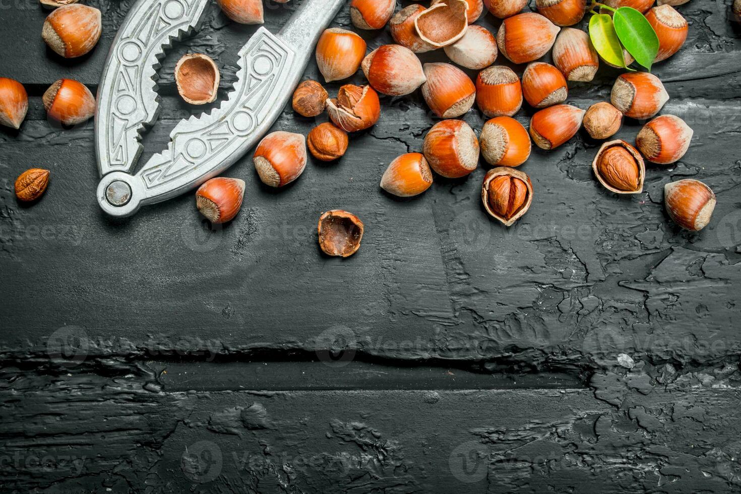Hazelnuts in a shell with a Nutcracker. photo