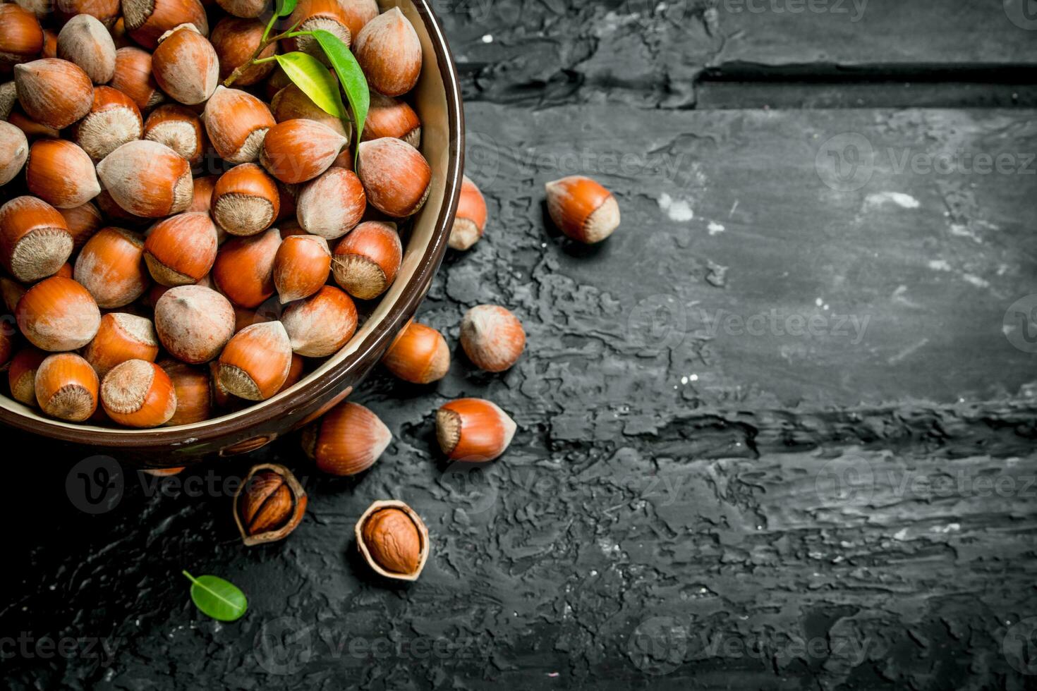 Hazelnuts in the bowl . photo