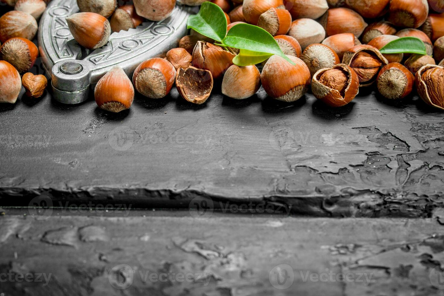 Hazelnuts in a shell with a Nutcracker. photo