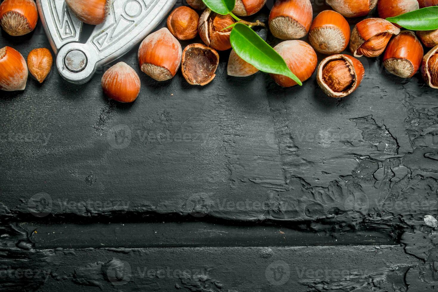 Hazelnuts in a shell with a Nutcracker. photo