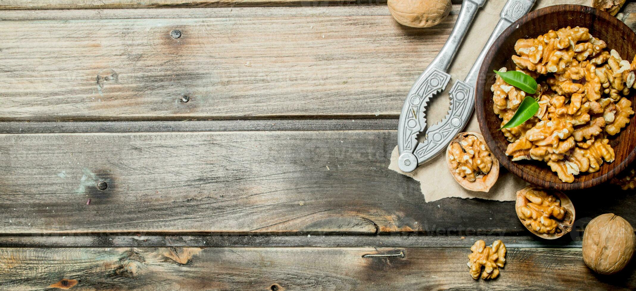 Shelled walnuts with a Nutcracker. photo