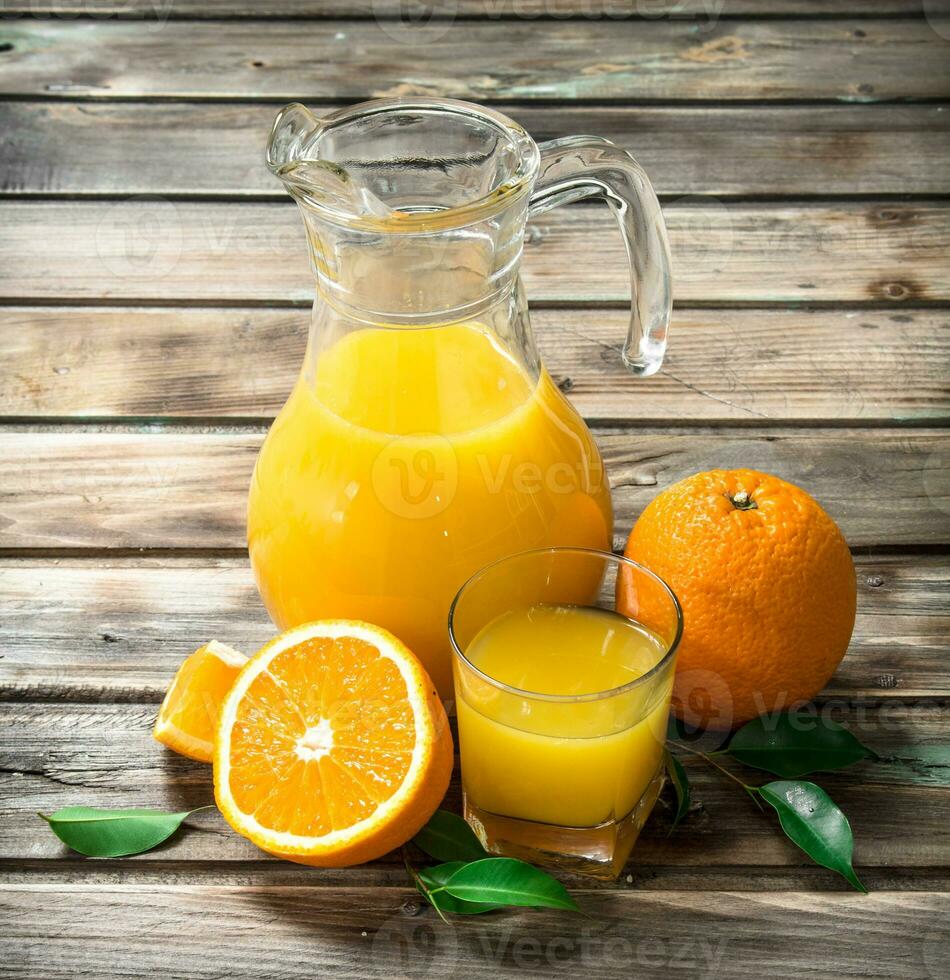 Orange juice in the pitcher. photo