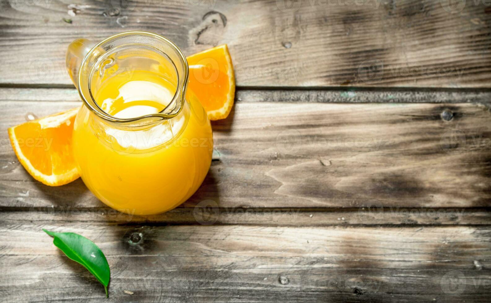 Orange juice in the pitcher. photo