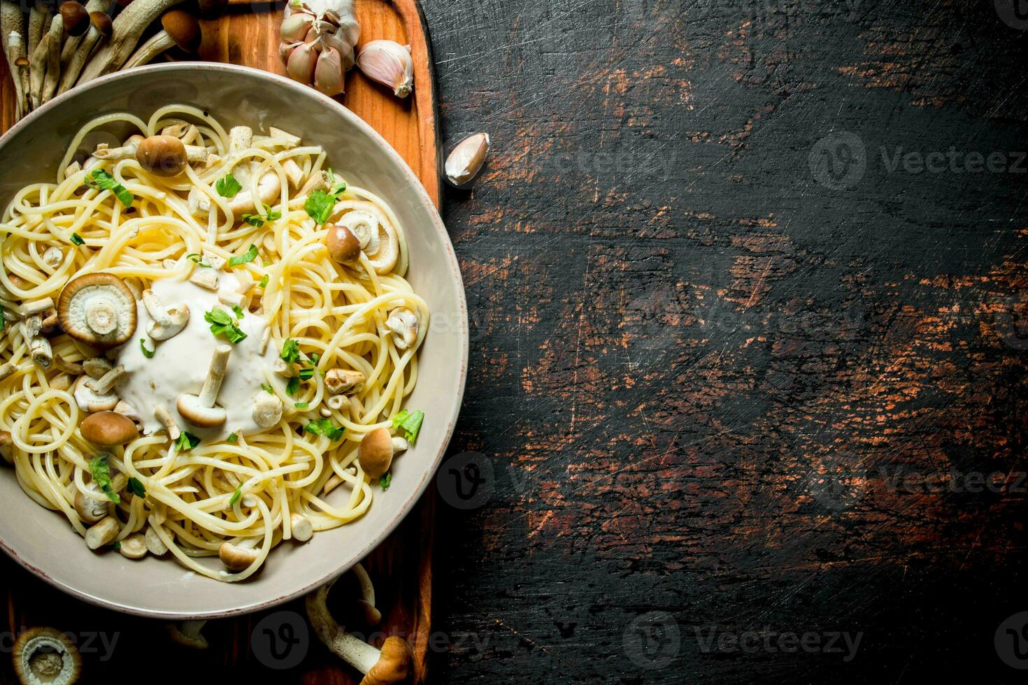 Pasta with mushrooms and sauce in a plate. photo