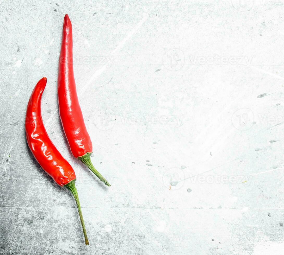 Two pods of red hot pepper. photo