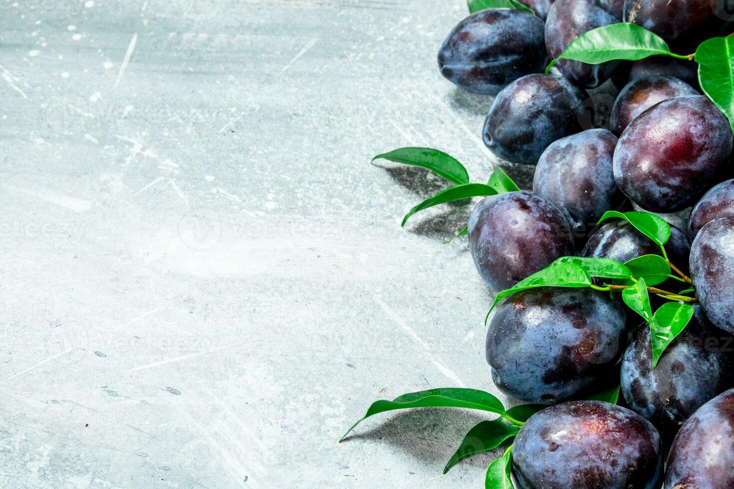 Fresh plums with leaves. photo