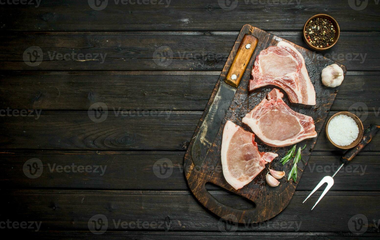 Raw pork steaks on the bone. photo