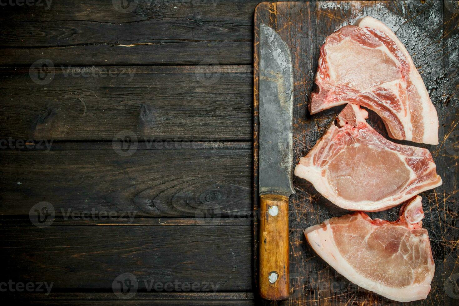 Raw pork steaks on the bone. photo