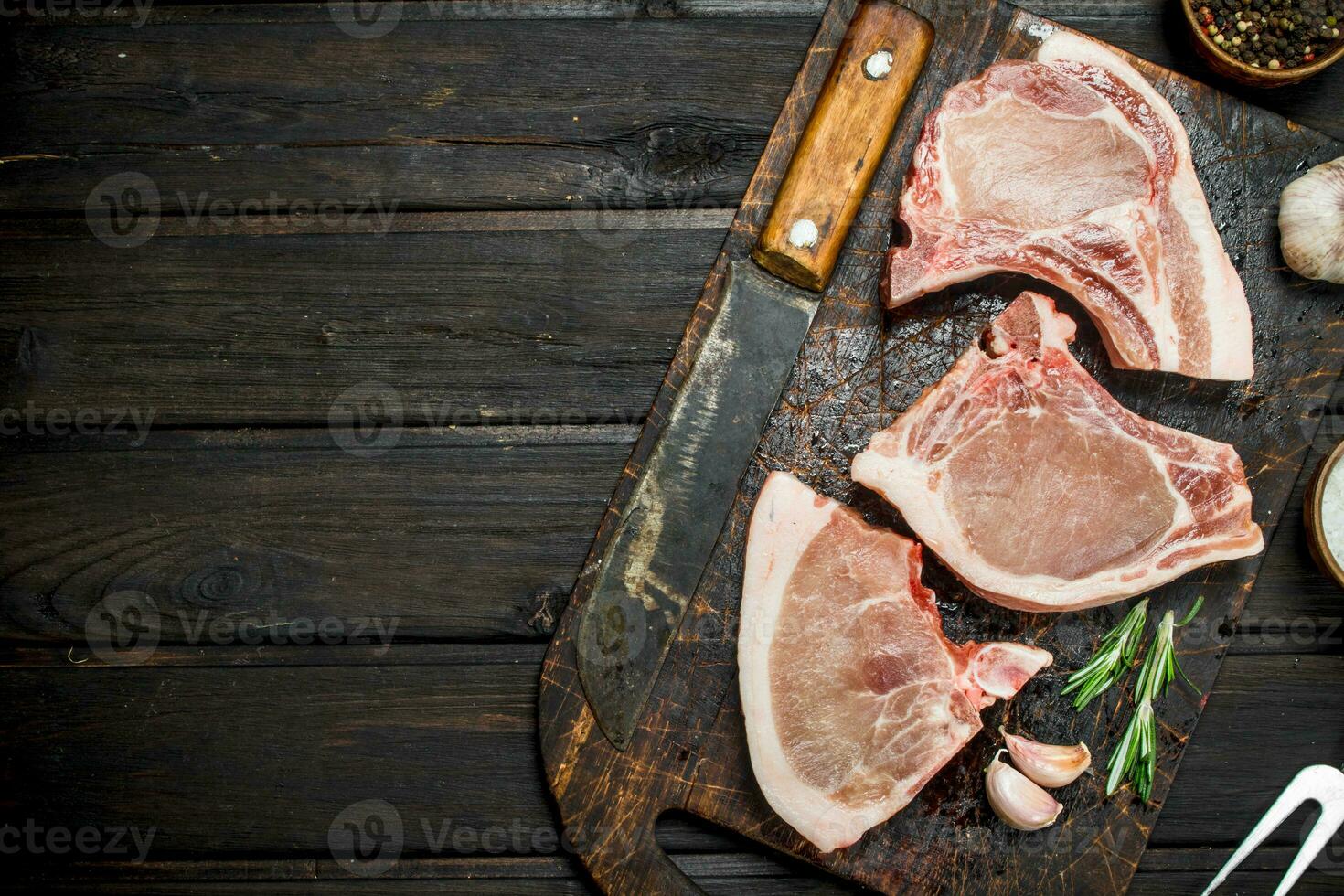 Raw pork steaks on the bone. photo