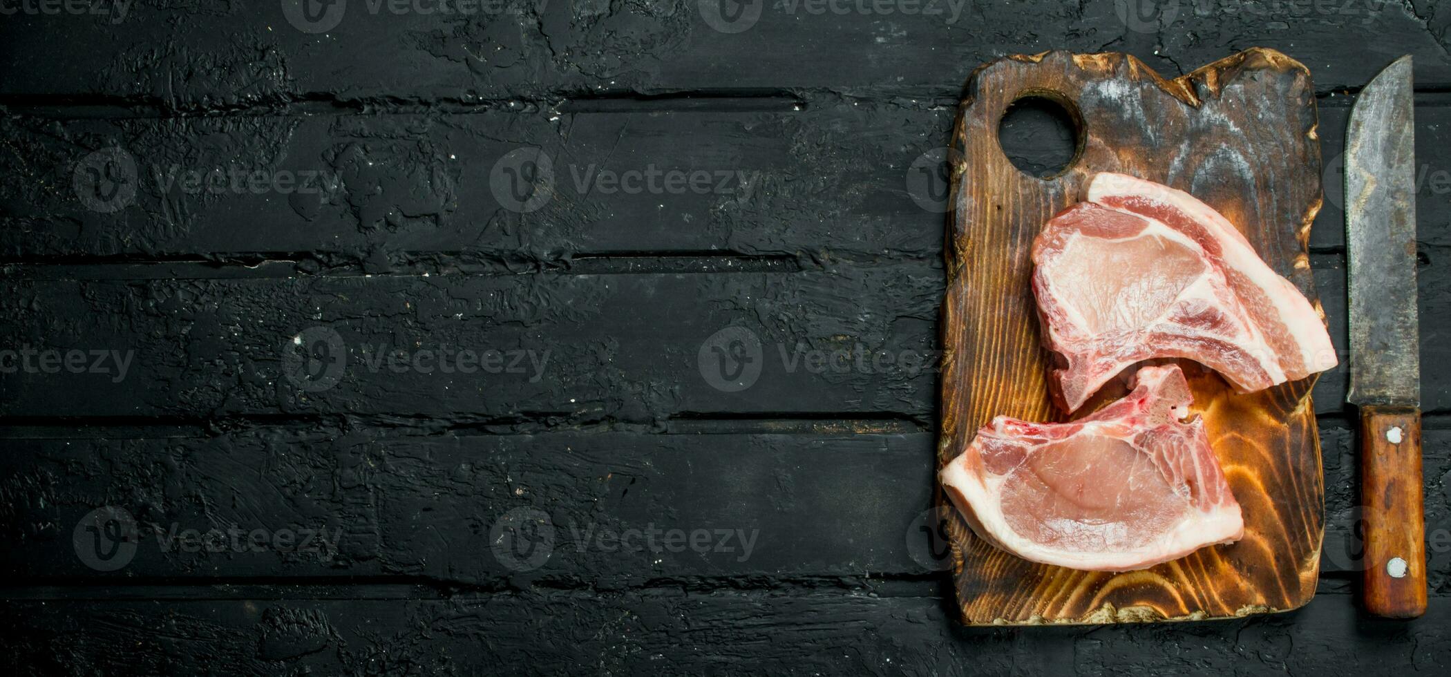 Raw pork steaks on the bone. photo