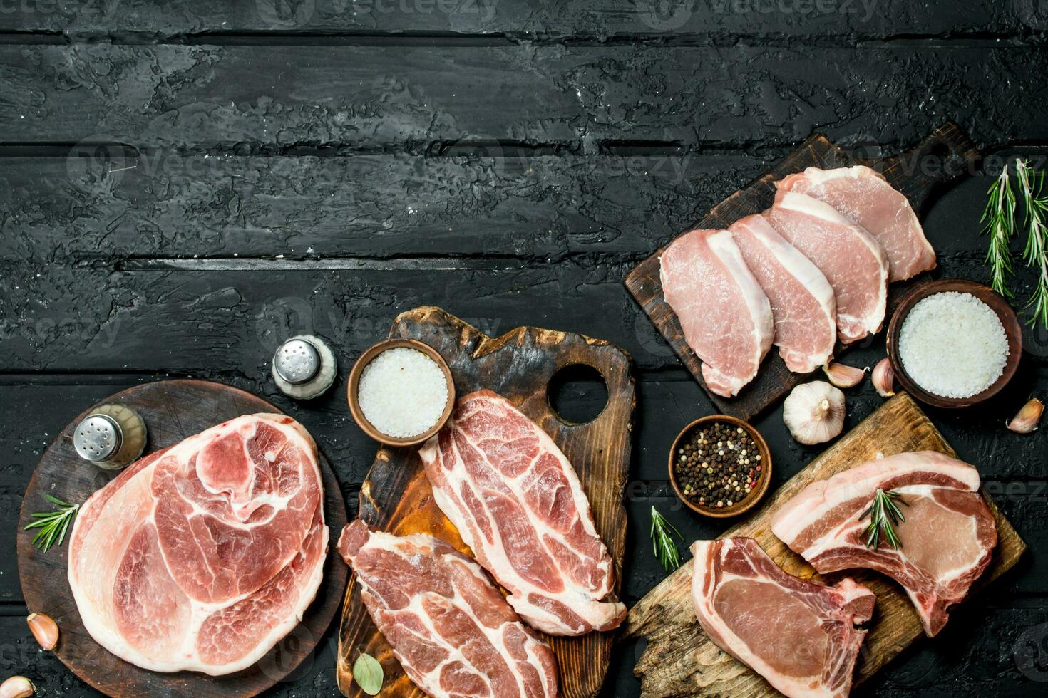 Different kinds of pork meat with spices. photo