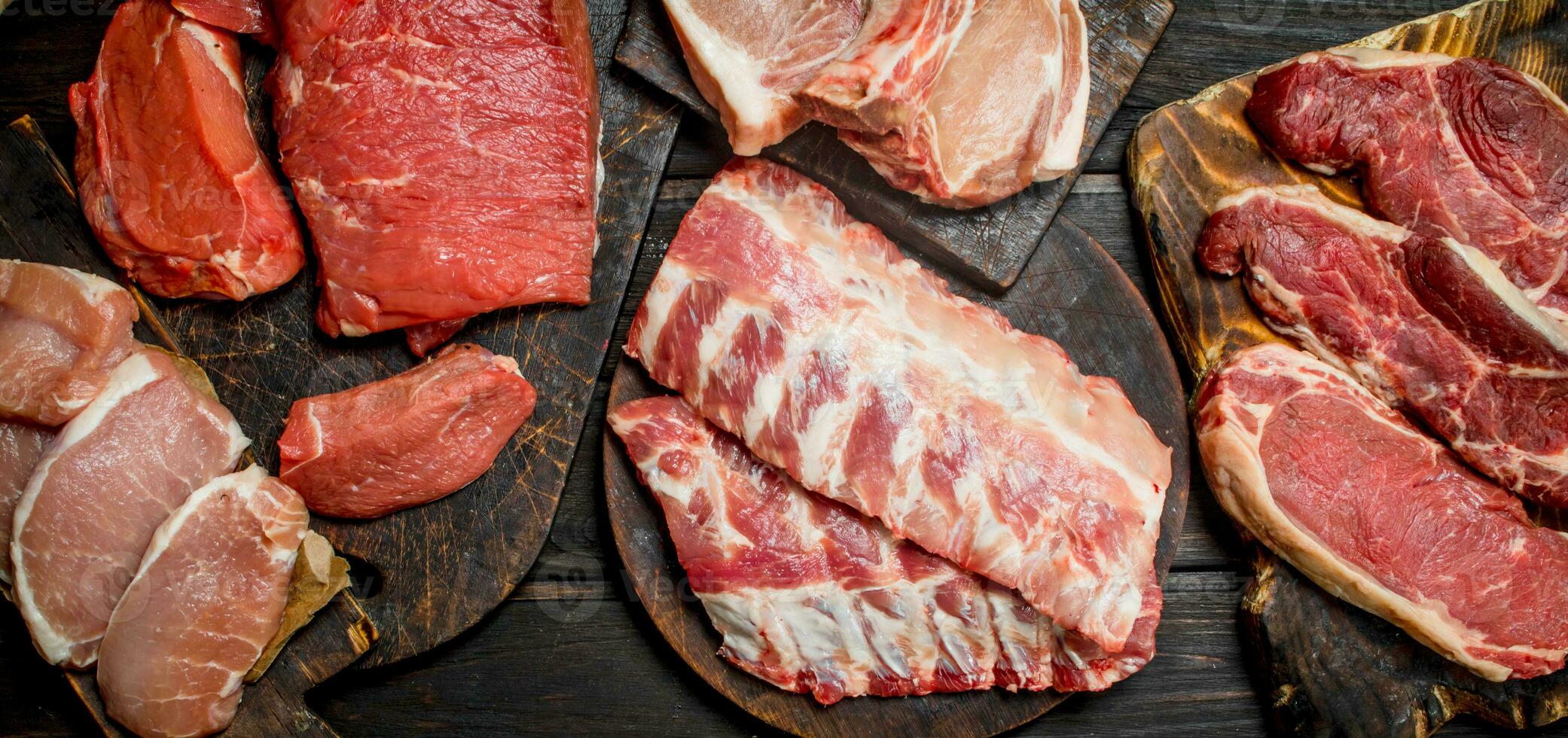 Raw meat. Different kinds of pork and beef meat. photo