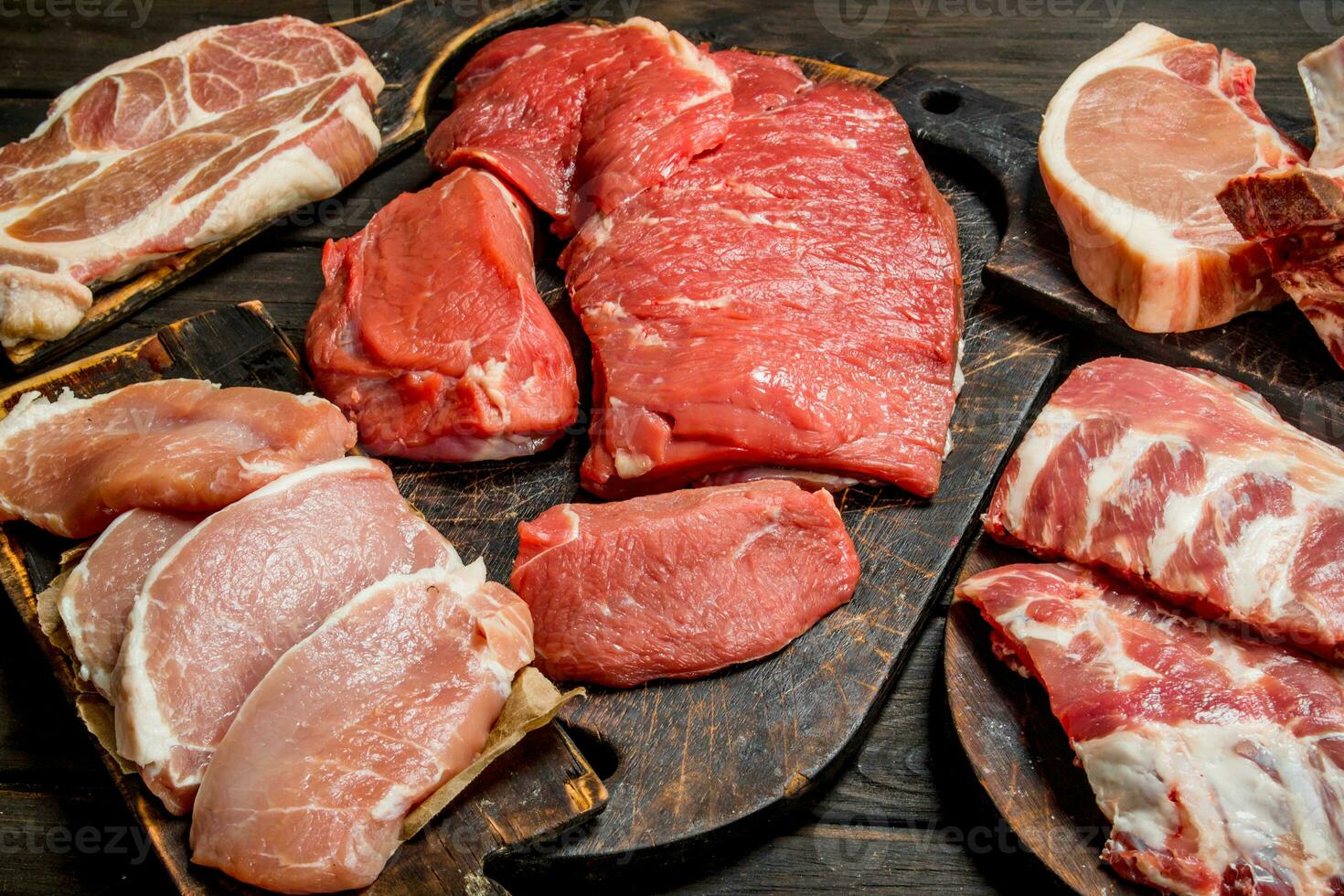 Raw meat. Different kinds of pork and beef meat. photo