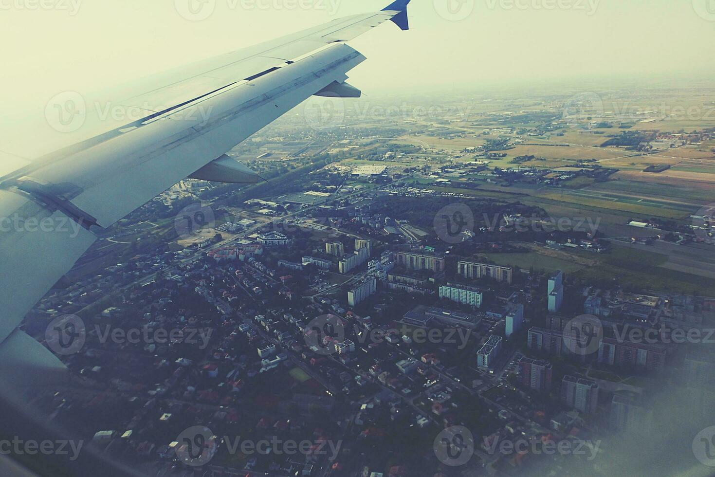 original view of the city of Warsaw in Poland from a flying plane photo