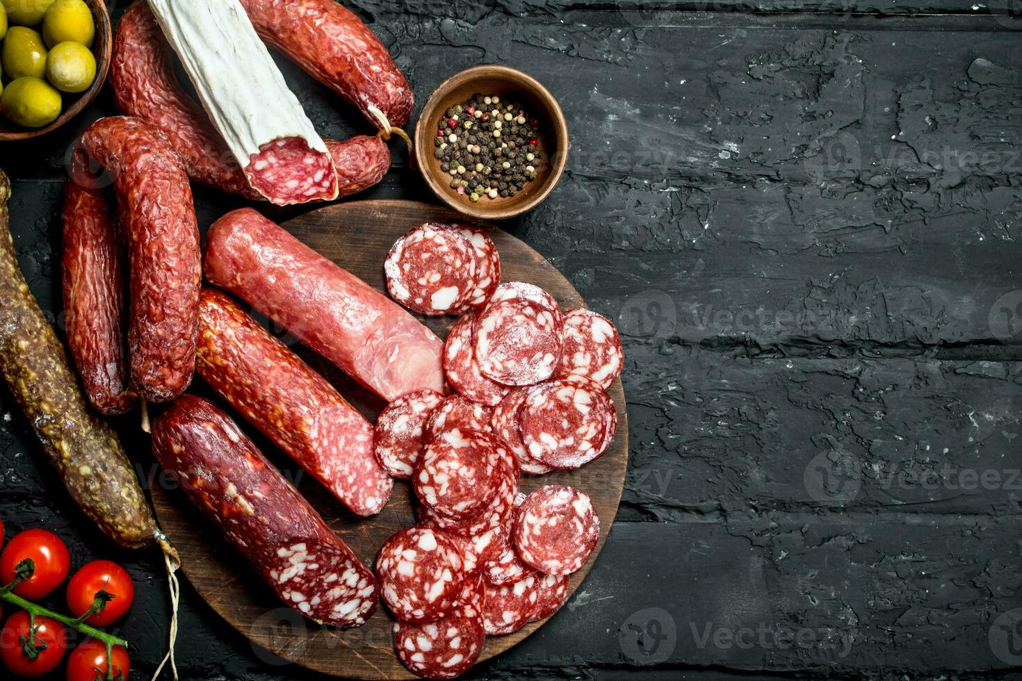 Different types of salami on the Board. 32010528 Stock Photo at Vecteezy