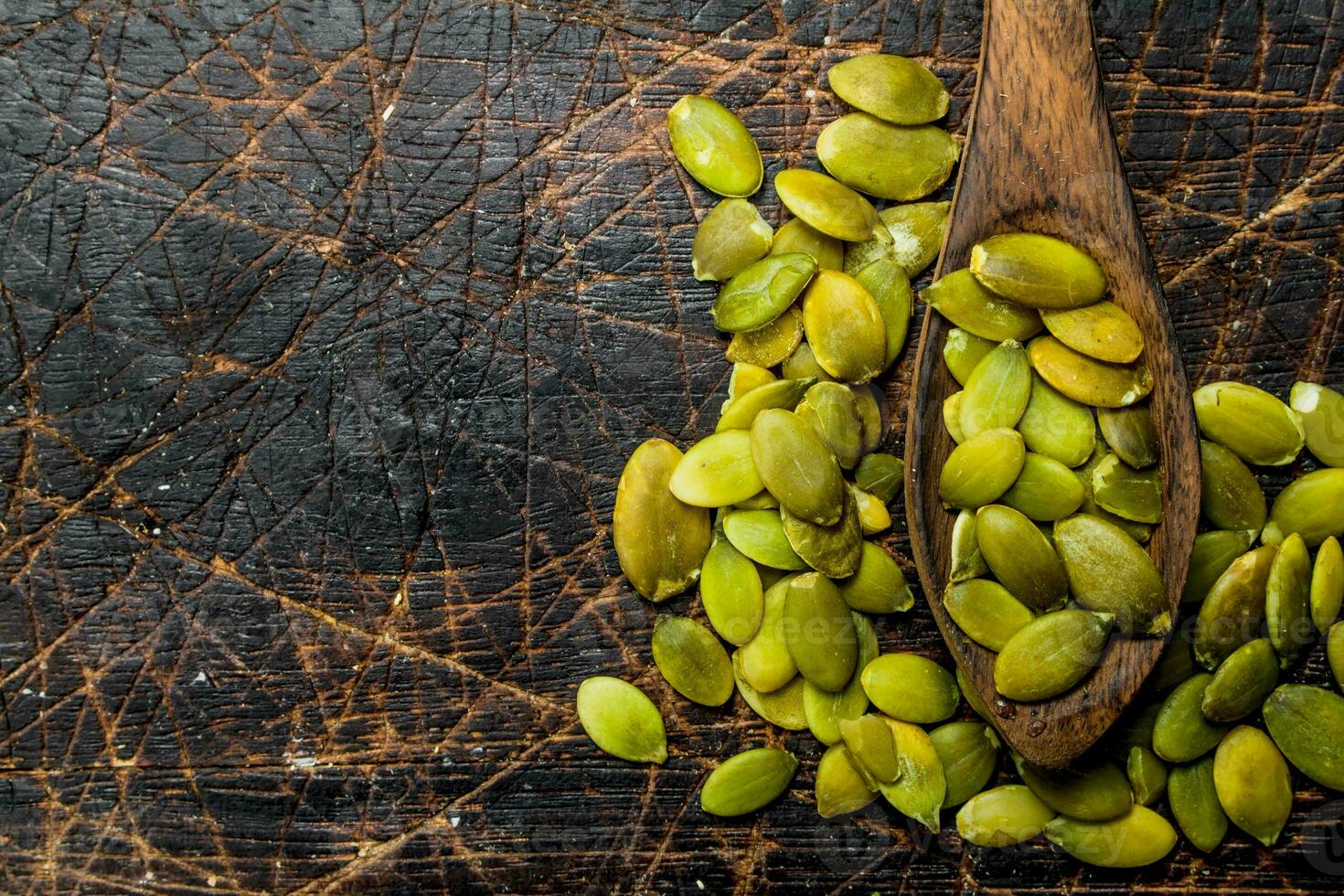 Pumpkin seeds in a spoon. photo