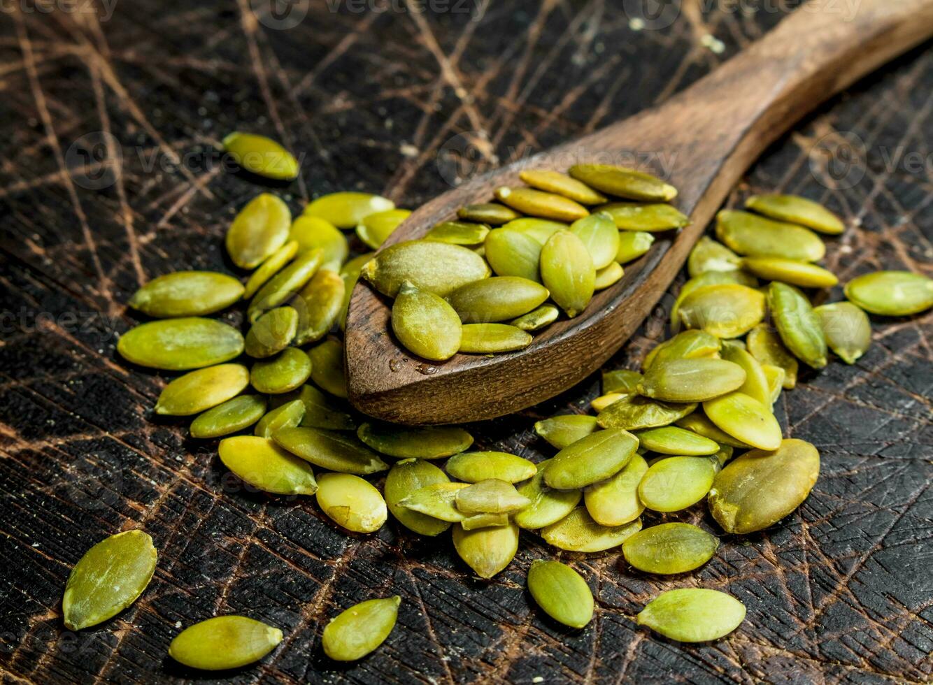 Pumpkin seeds in a spoon. photo