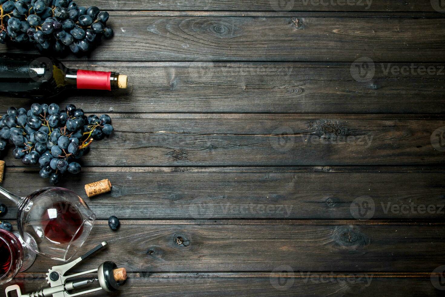 Wine background. Red wine with corkscrew. photo