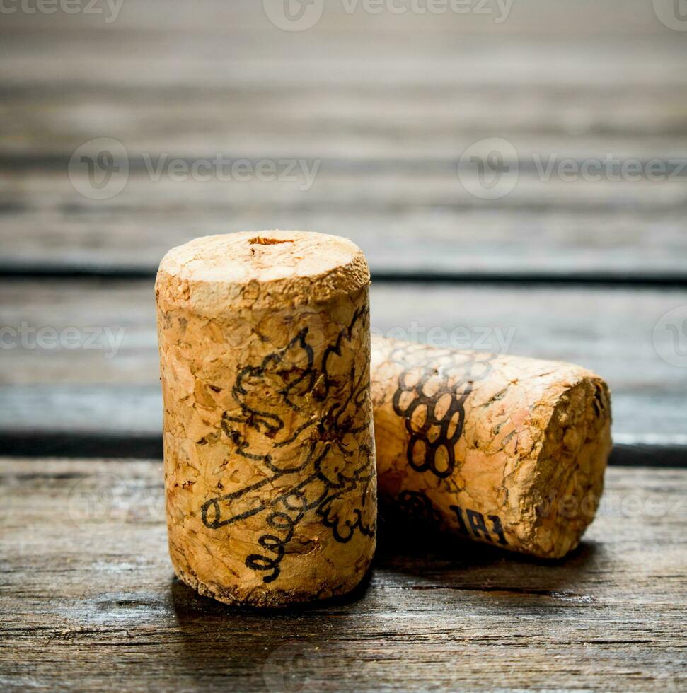 Wine corks on wooden background. photo