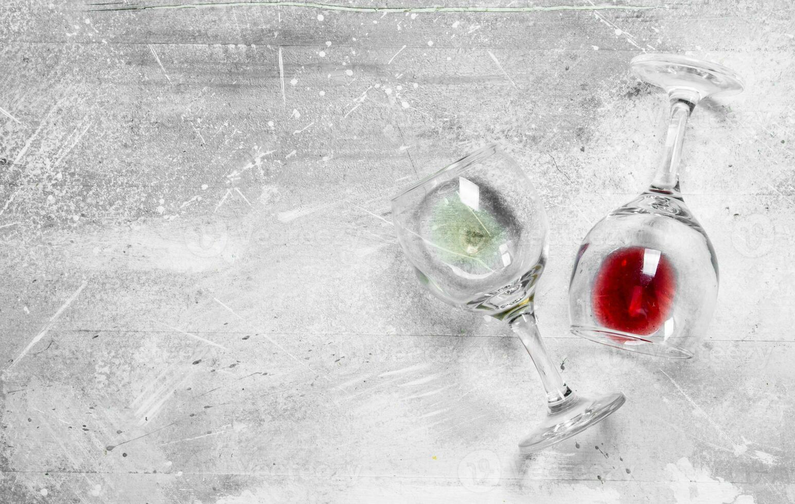 Wine background. Glasses of red and white wine. photo