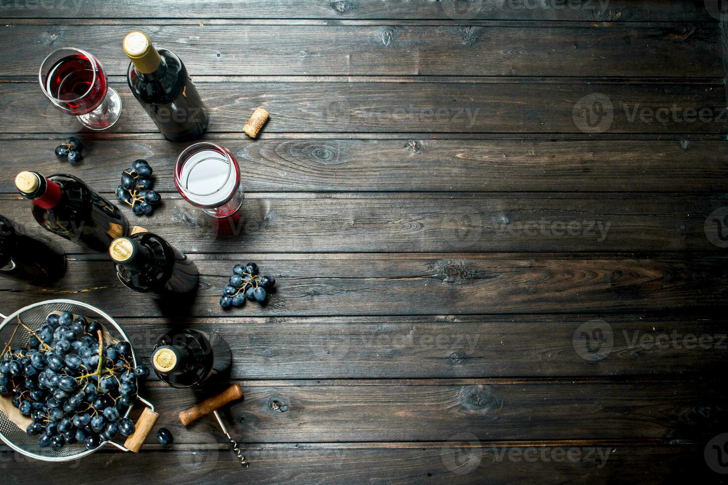 Wine background. Red wine in glasses with grapes. photo