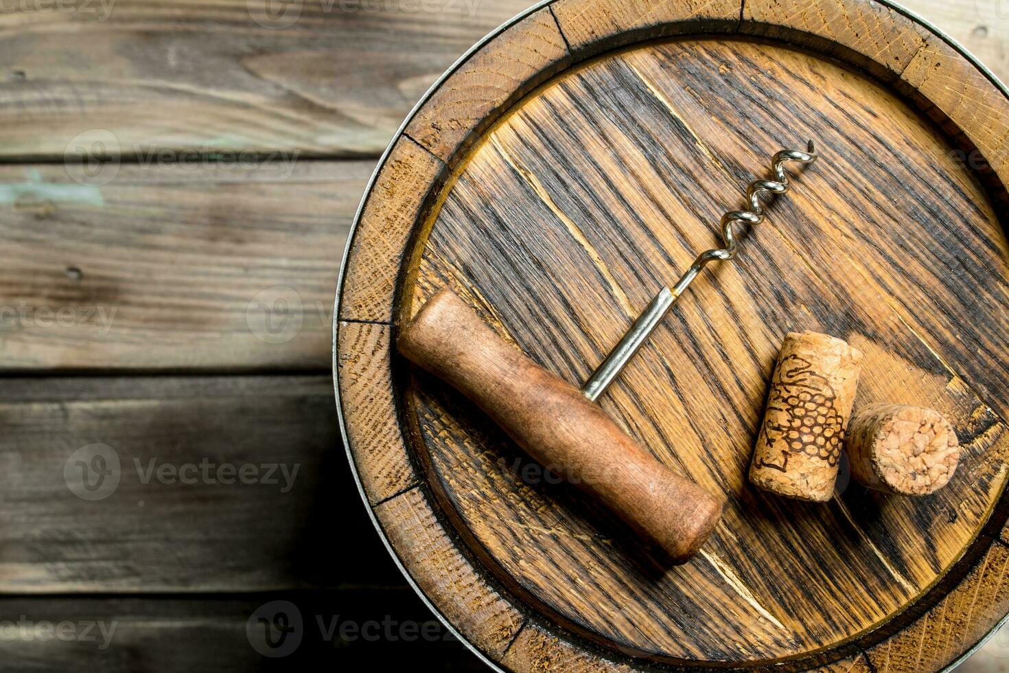 Wine background. Barrel of wine and a corkscrew from the top. photo