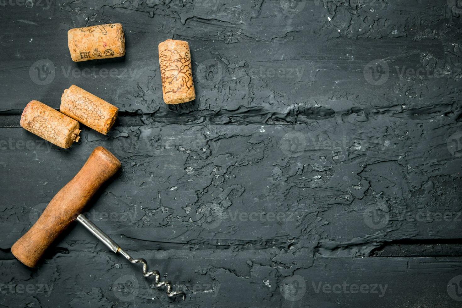 Corkscrew with corks. photo