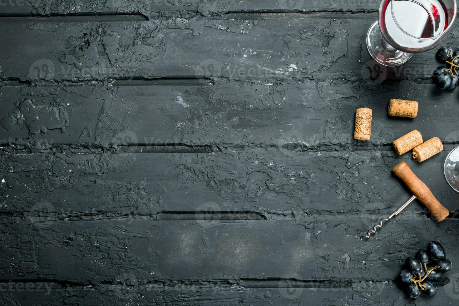 Red wine with corkscrew. photo