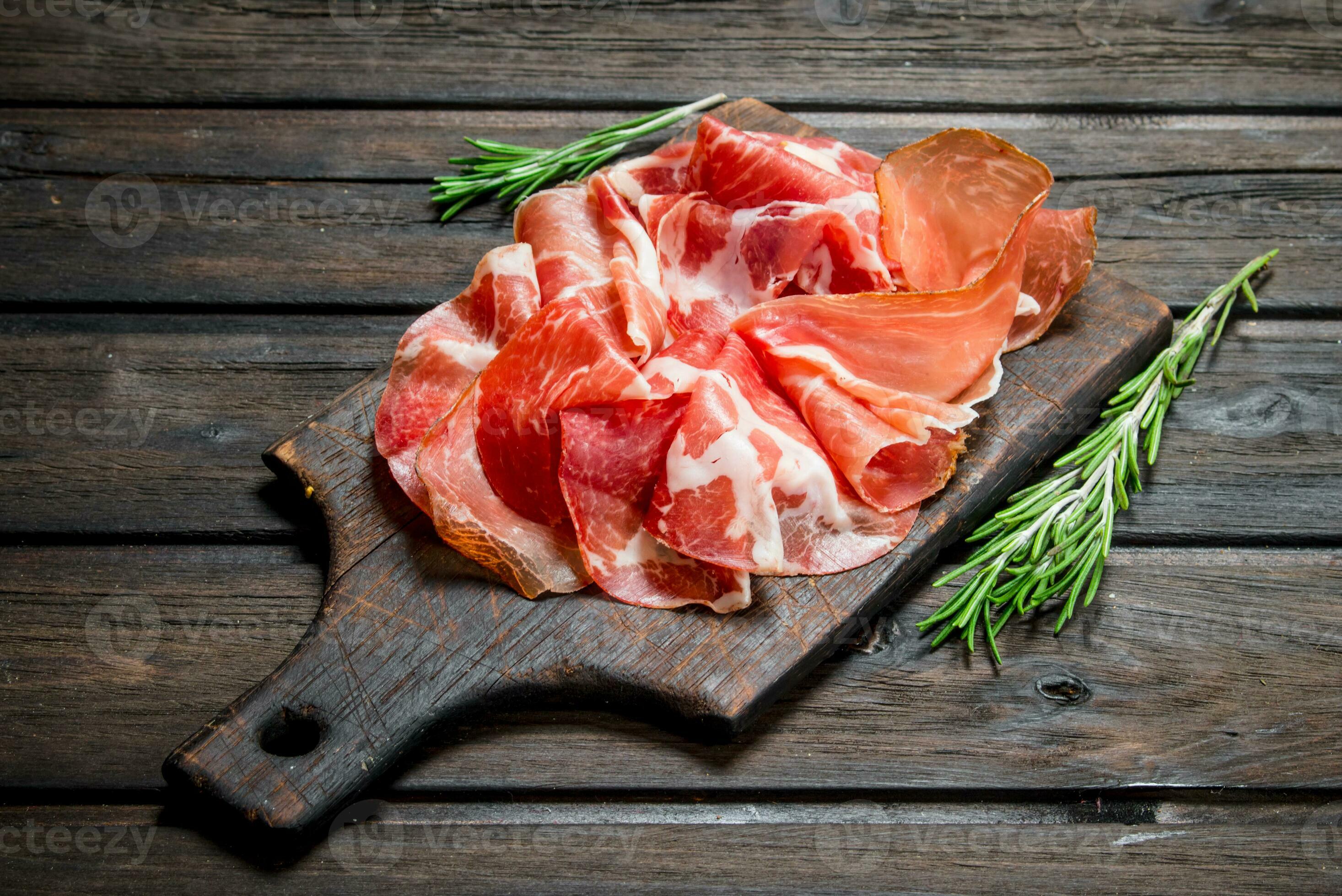 Spanish ham on the chopping Board. 32012394 Stock Photo at Vecteezy