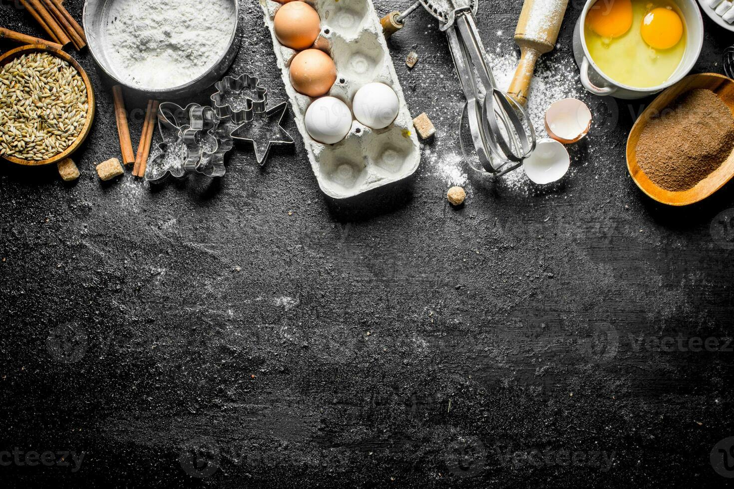 Baking background. Flour with cocoa, eggs and baking forms of the dough. photo