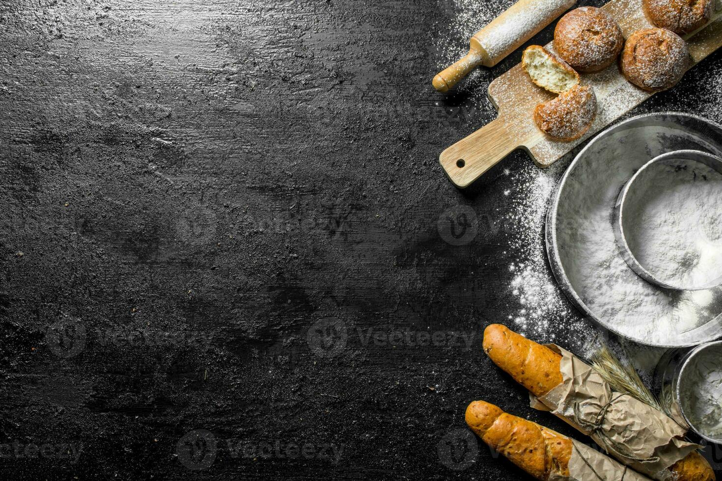 French baguette and fresh buns with flour. photo