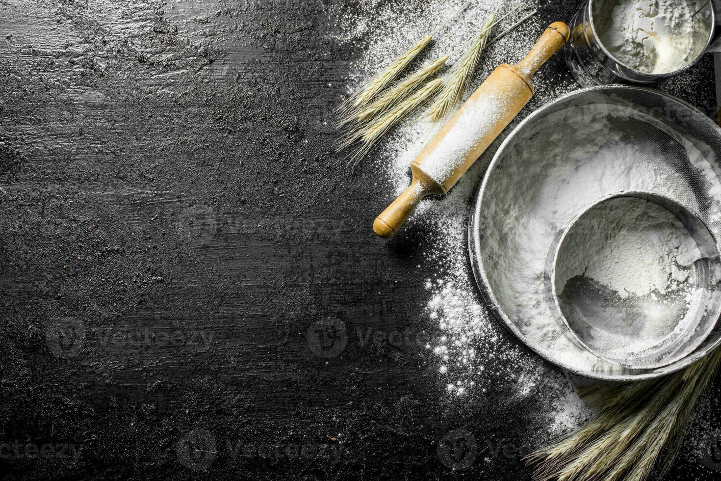 Various sieve with flour. photo