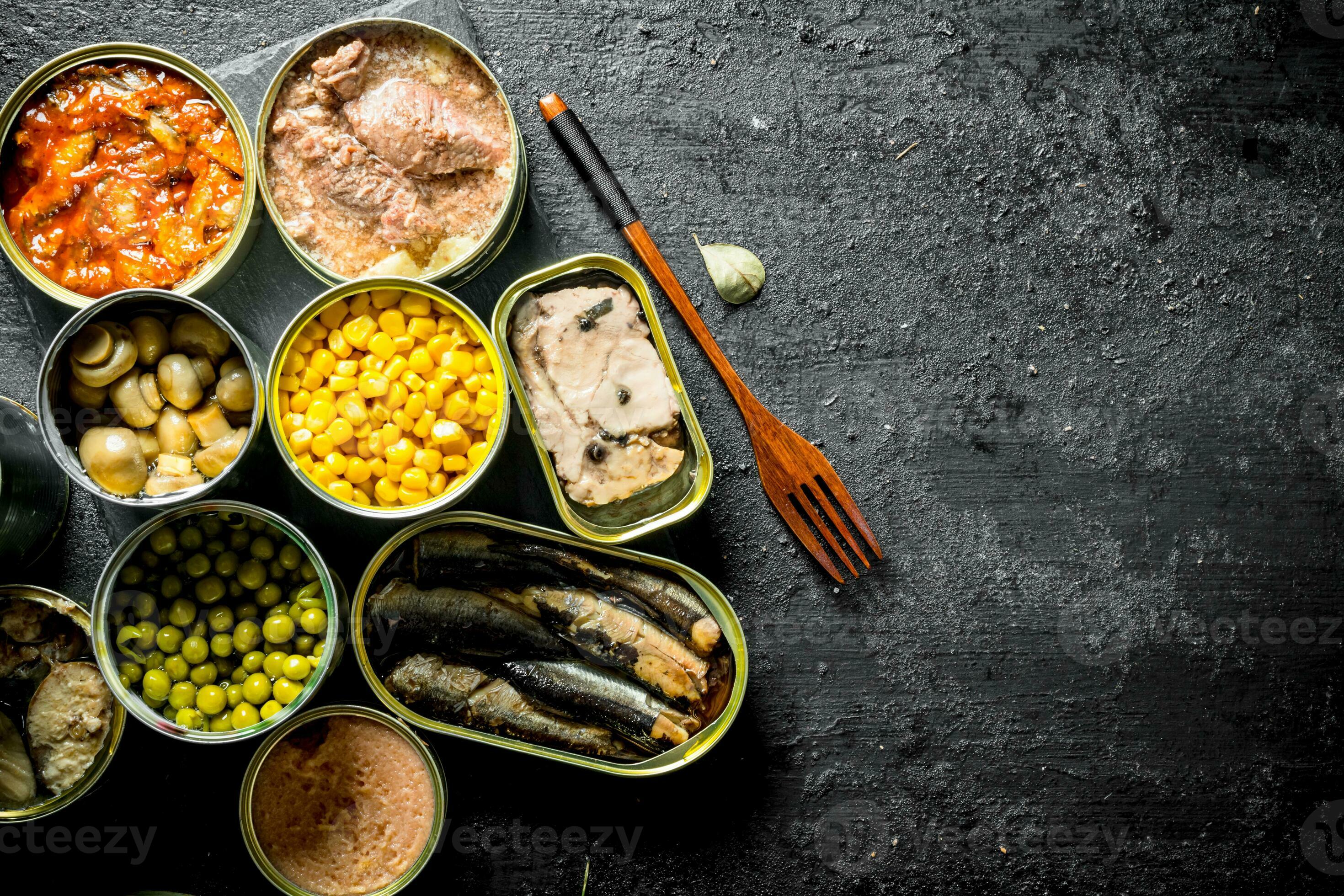 Canned food in open cans. 32013002 Stock Photo at Vecteezy