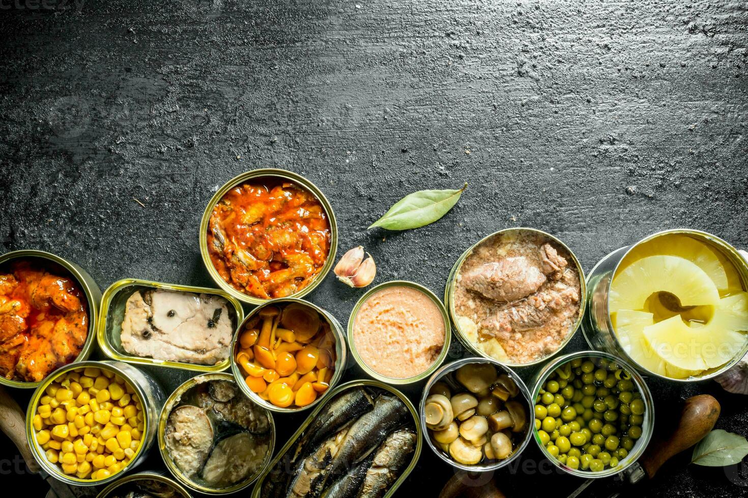 Various canned food in open cans. 32013019 Stock Photo at Vecteezy