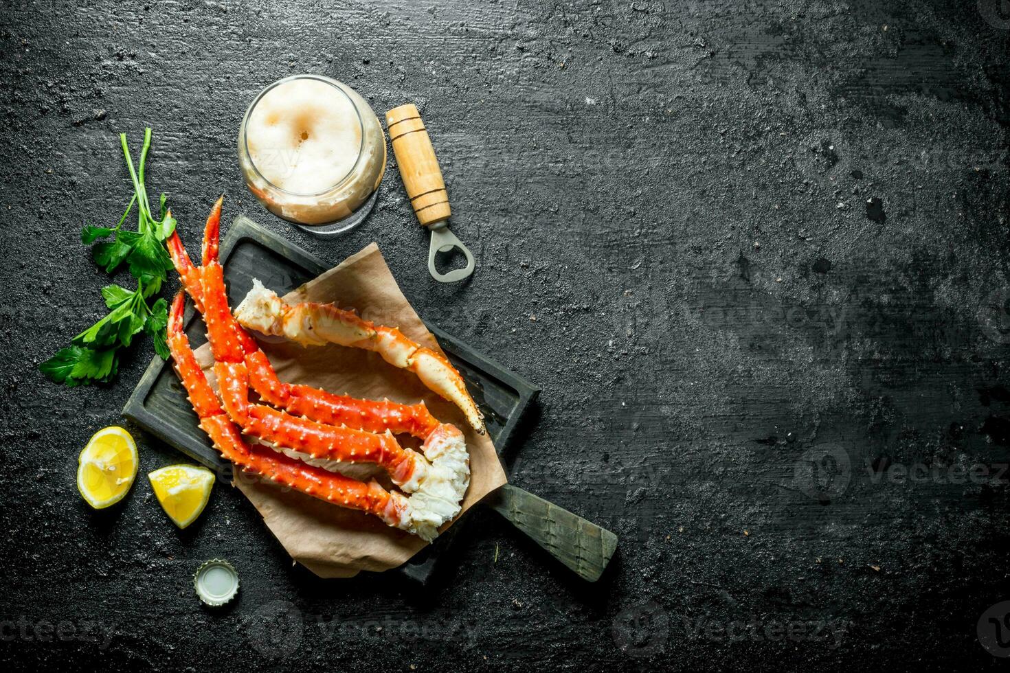 Crab with beer, parsley and lemon slices. photo