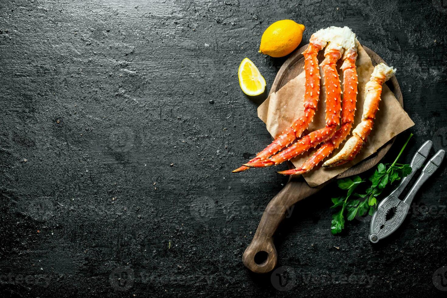 Crab on a cutting Board with lemon and parsley. photo