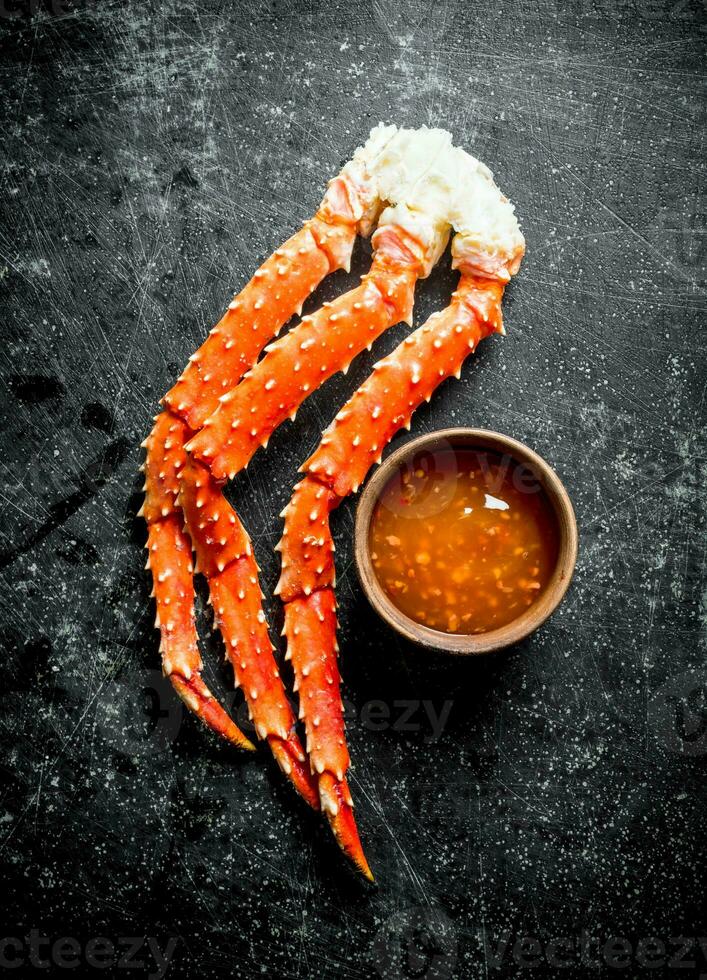 Crab with sauce in bowl. photo