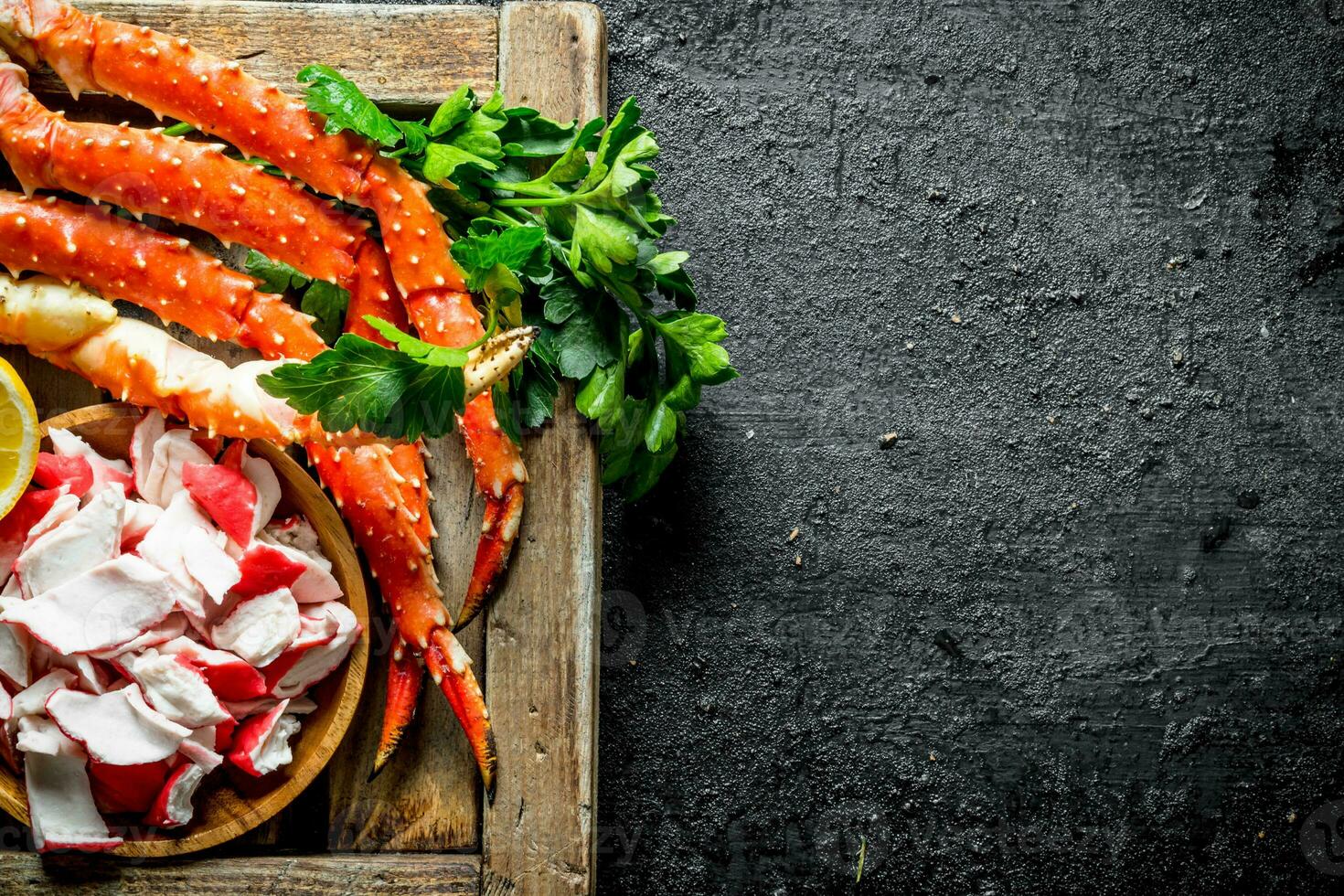 Crab meat and boiled crab on tray with greens. photo
