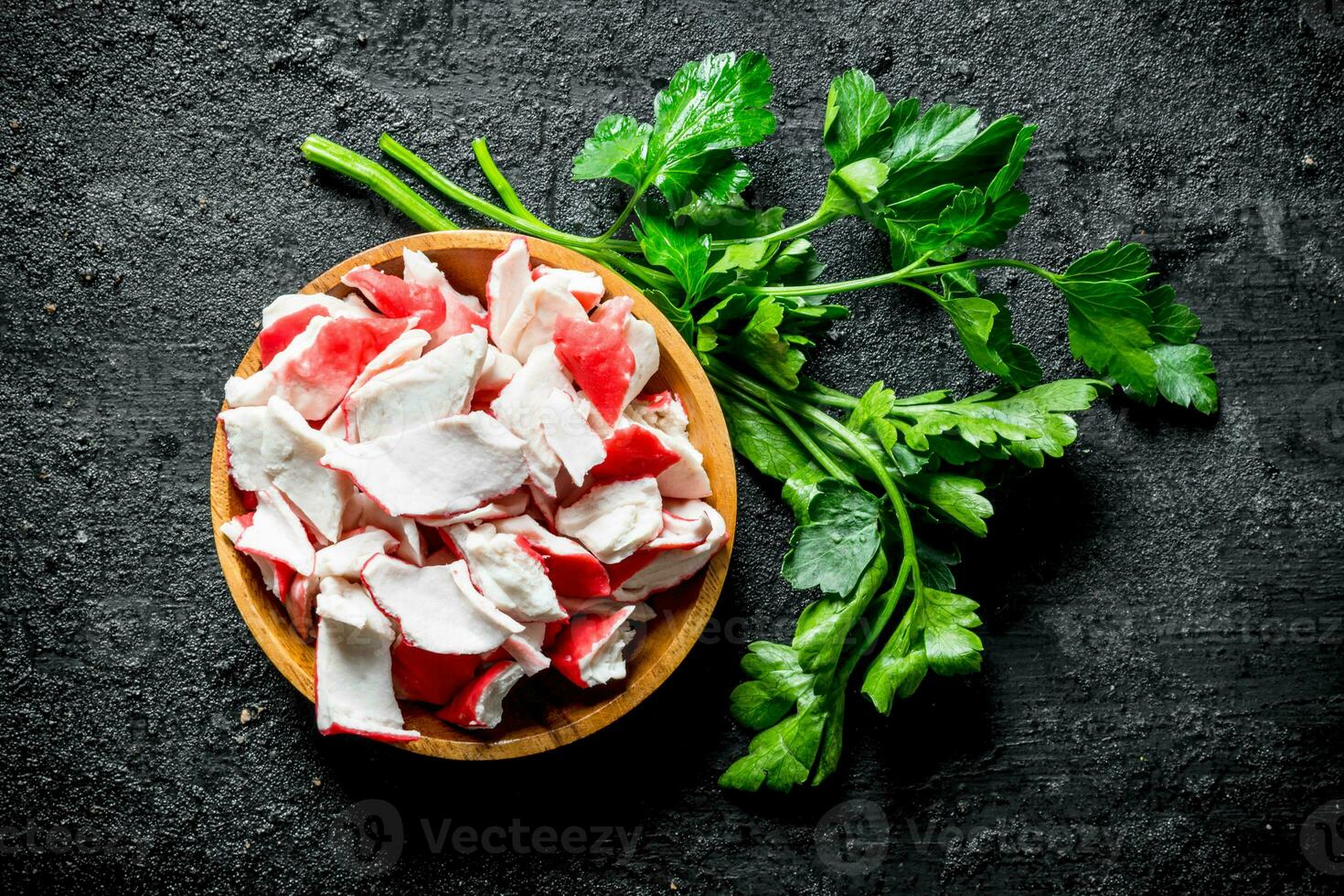 Crab meat on a plate of parsley. photo
