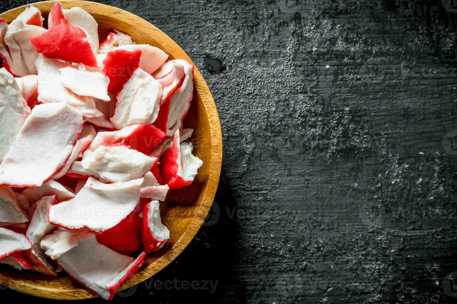 Crab meat on a wooden plate. photo